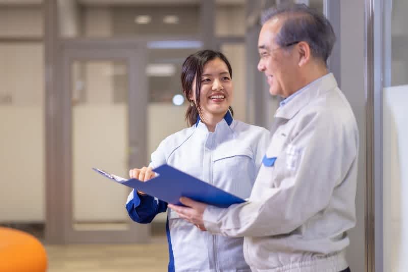 Engineers having a discussion with smiling faces