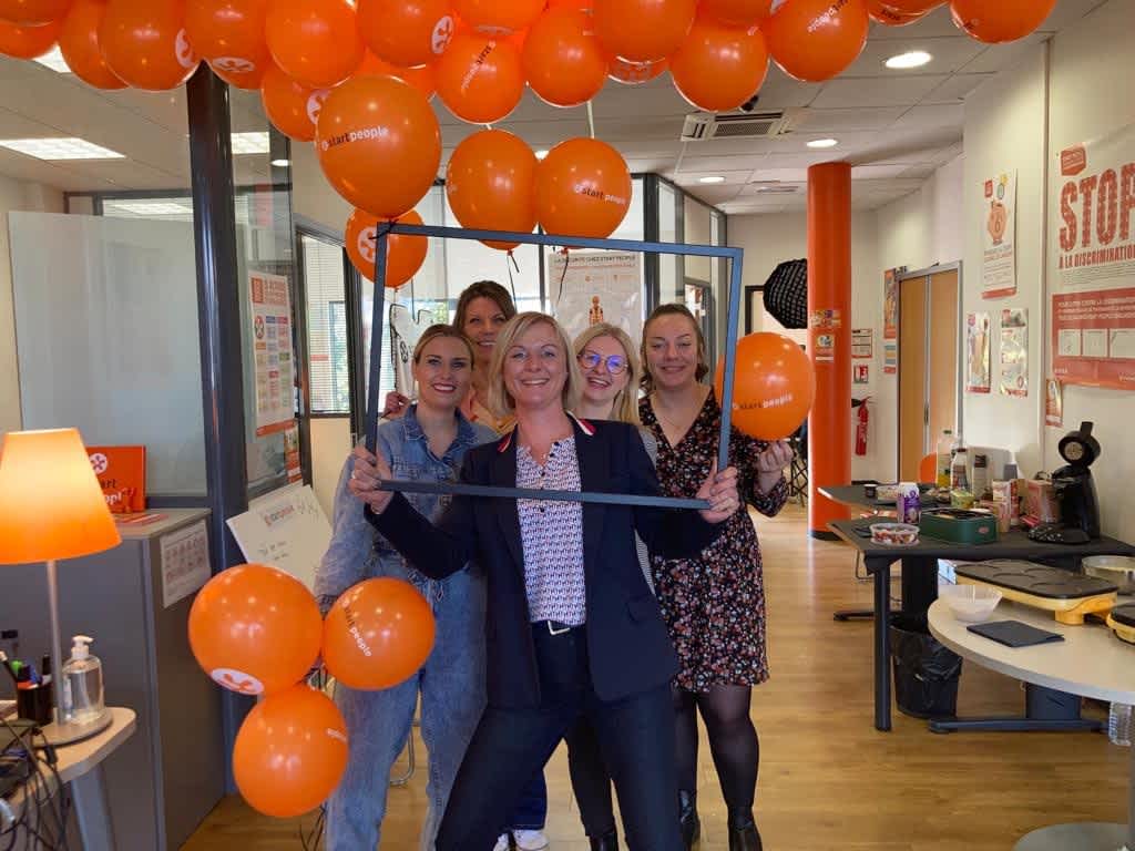 Employees enjoy a Fête de l'intérimaire at a Start People France branch.